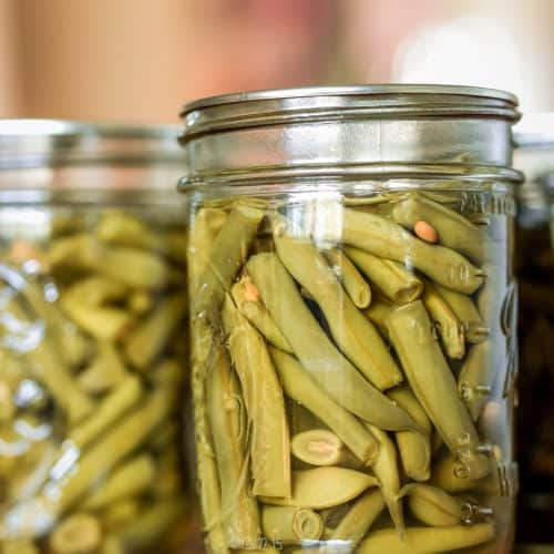 Old-fashioned canned green beans in quart mason jars.